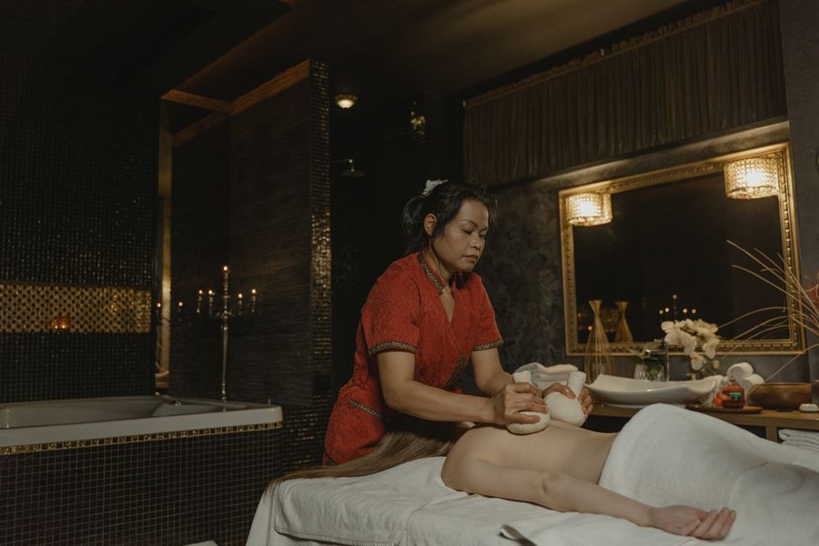 Massage therapist in a spa room